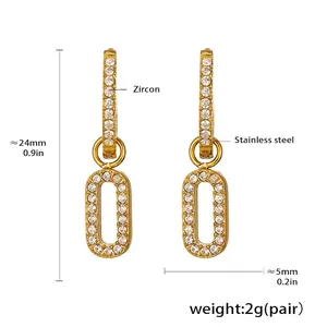 Detail view of 18k gold plated stainless steel drop earrings with zircon crystals