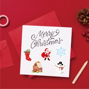 Detailed view of Christmas stickers featuring Santa and Snowman in a festive gift setting