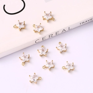Nine gold star-shaped zircon pendants with clear crystals for DIY jewelry making