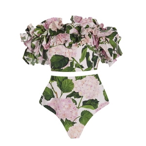 Flat lay of ruffle off-shoulder bikini top and floral high-waist bottoms