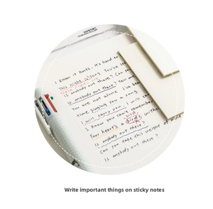 Macro shot of waterproof transparent sticky notes with handwritten notes and multi-color pen