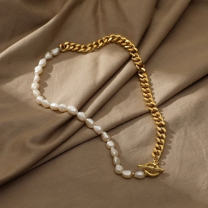 Detail of vintage 14k gold-plated curb chain with baroque pearls and elegant OT clasp