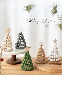 Detailed view of five creative Nordic wooden mini Christmas tree table ornaments on a tray