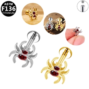 Détail de bijou de piercing araignée en titane F136 avec filetage interne et zircon rouge