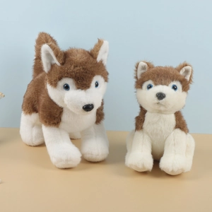 Plush husky stuffed animals in sitting and standing poses with brown and white fur