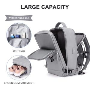 Gray travel backpack detail showing large capacity wet bag and shoe compartment
