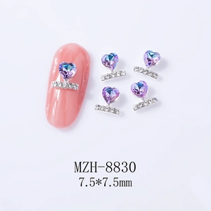 Detailed view of heart-shaped purple nail charms with silver base and 7.5x7.5mm dimensions