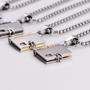 Stainless steel book pendant necklaces with heart cutout in silver, gold, and rose gold