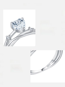 Macro detail of heart-cut moissanite stone and S925 sterling silver engraved hallmark