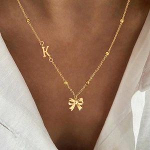 Golden butterfly necklace with letter K pendant on delicate beaded stainless steel chain