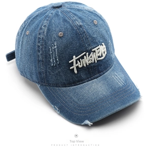 Detailed top view of washed blue denim baseball cap with white Funky Team embroidery