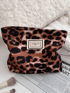 Vintage leopard print cosmetic bag with zipper and logo patch on soft textured fabric