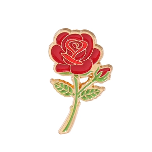 Elegant red rose brooch with green leaves, crafted in metal and enamel for weddings