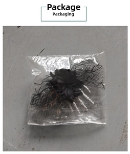 Detail view of Halloween skeleton hand hair clip with black rose and mesh in packaging