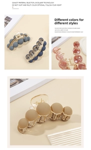 Close-up of matte and glossy bubble design hair claw clips in assorted elegant colors