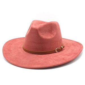 Close-up of pink suede fedora hat with brown leather band and gold metal buckle detail