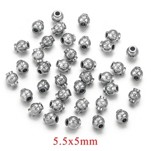 Macro detail of 5.5x5mm silver corrugated stainless steel spacer beads for DIY jewelry