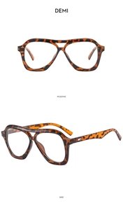 Detail view of large aviator sunglasses in demi tortoiseshell finish with dual bridge design