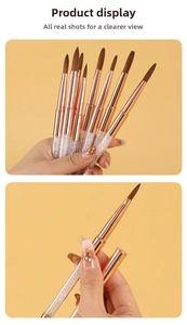 Detail of rose gold nail art brushes with crystal filled handles and fine brown tips