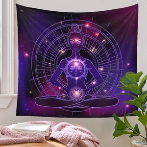 Detail of meditation tapestry with galaxy star patterns and a sun symbol on fabric