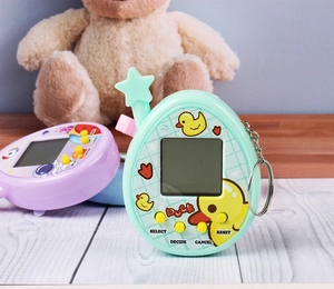 Detail showing mint green and purple virtual pet machines with duck theme and keychains