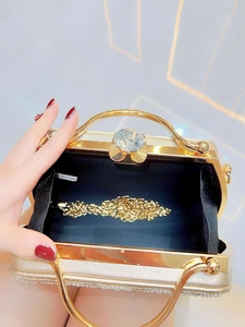Elegant gold rhinestone evening clutch bag with pearl accents and detachable chain strap
