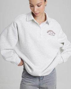 Close-up of the vintage SOHOHOUSE EST1988 letter print on the grey cotton polo sweatshirt