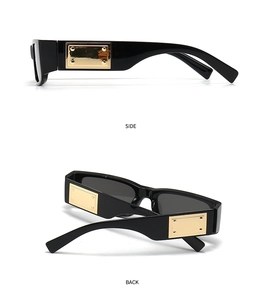 Detail of black square sunglasses with side metal accent and sleek polished temple