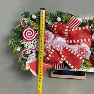 Christmas upside-down tree door decor with candy canes and bow, length 30cm measurement