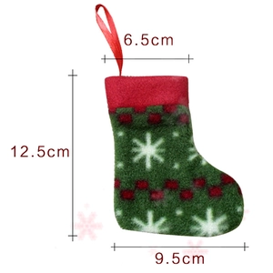 Miniature green felt Christmas stocking cutlery holder with dimensions 12.5cm height