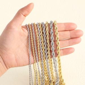 18k gold and silver stainless steel rope chains in multiple thicknesses held in hand
