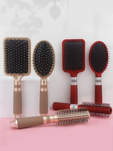 Detail of 3-piece hairbrush set with air cushion massage combs and anti-static bristles