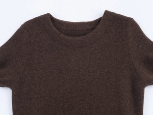 Close-up of brown crew neck knit dress featuring soft faux fur texture and wool fabric