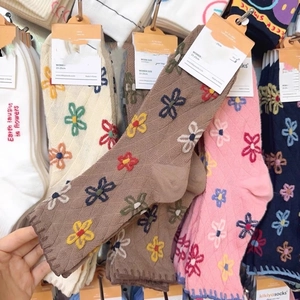 Women's vintage floral cotton crew socks featuring cute embroidery and rolled cuffs
