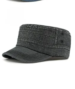Detail of black washed denim military cap showing metal eyelets and neat stitching