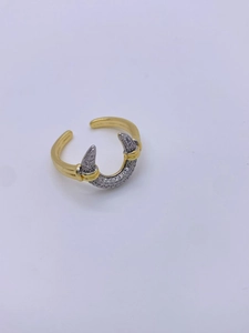 Detail of two-tone 18K gold and silver geometric ring with pavé zircon setting