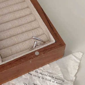 Minimalist 925 sterling silver U-shaped ring displayed in a vintage wooden jewelry box