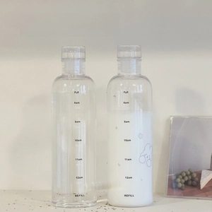 Detail of transparent water bottles featuring black time markers and cute rabbit design