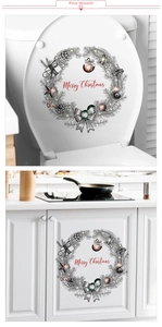 Detail of hand-drawn Christmas wreath sticker with pine cones and Merry Christmas text