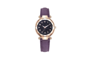 Close-up of starry sky dial and faceted glass on a purple leather strap watch