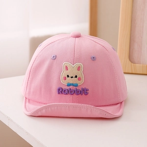 Detail of baby girl pink cotton cap featuring cute 3D rabbit embroidery and soft brim