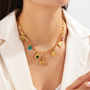 Layered gold-plated stainless steel chain necklace with heart charms and colorful diamonds