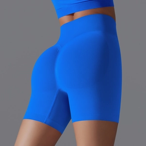 Detail of high-waisted Klein blue seamless yoga shorts with ribbed tummy control texture