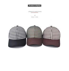 Detailed view of thick houndstooth plaid baseball caps in multiple color patterns
