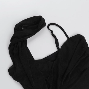 Detail view of black knitted one-shoulder lace-up top with asymmetric pleated neckline