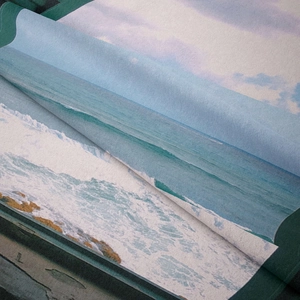 Detailed close-up showing soft microfiber texture and ocean wave print of the tapestry