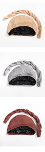Detail of turbans showing black satin lining and braided accents in three colors