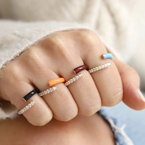 Double layered gold open rings with colorful enamel and zircon stones on hand