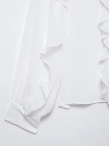 Detail of white ruffle trim and pleated texture on lightweight chiffon long sleeve shirt