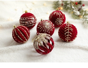 Detail of 8cm wine red velvet Christmas balls with intricate gold sequins and glitter patterns